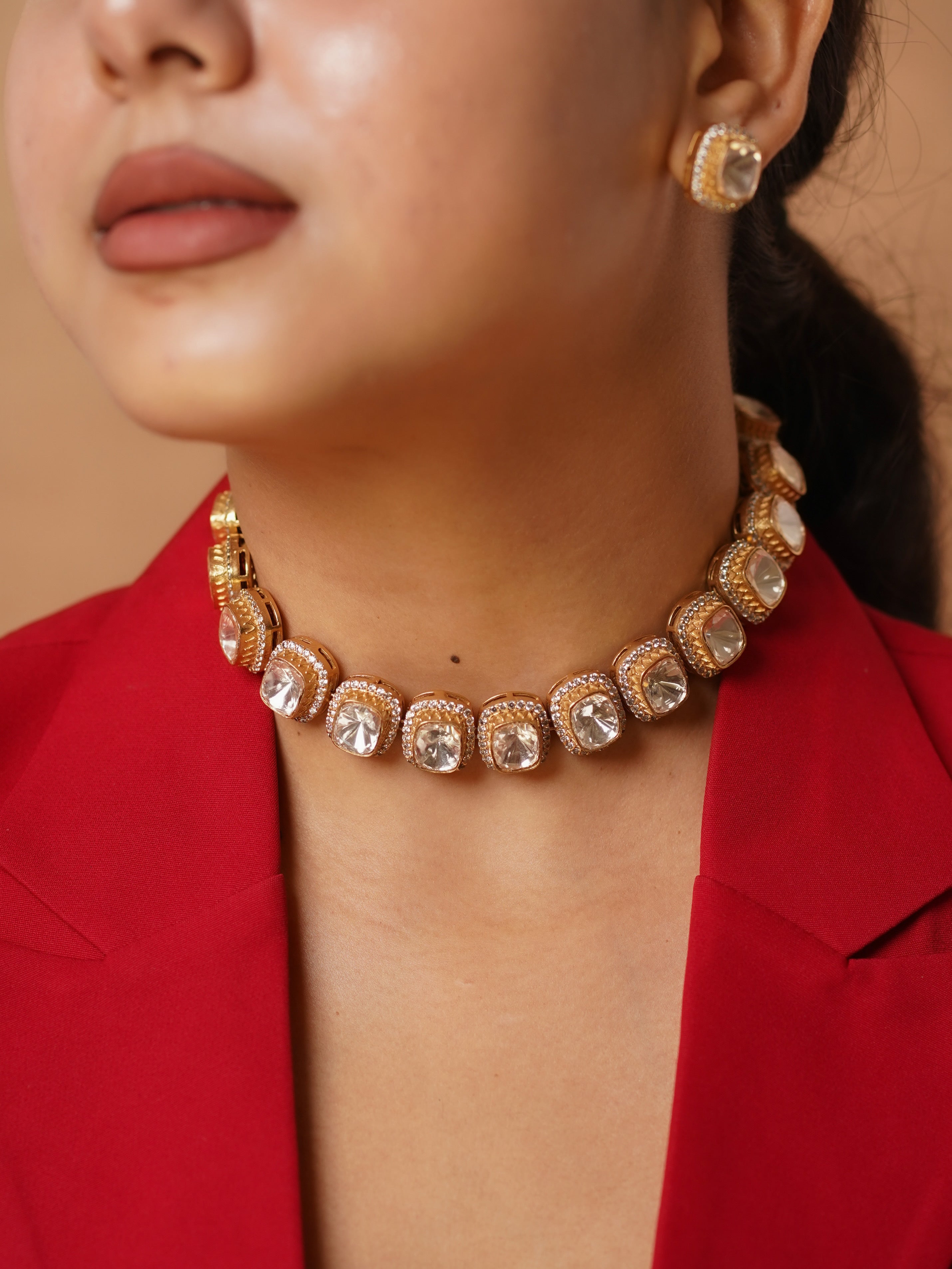 Front view polki choker necklace with cushion-cut crystals and gold-toned stud earrings